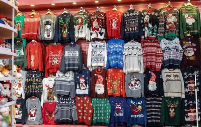 a large number of fast fashion christmas sweaters on display in cothing store a large number of fast fashion christmas sweaters on display in cothing store