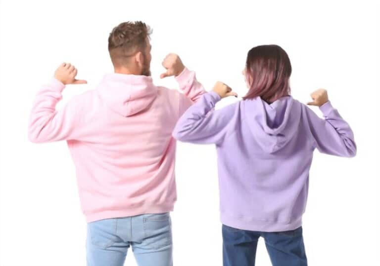 young couple in colourful hoodies young couple in colourful hoodies