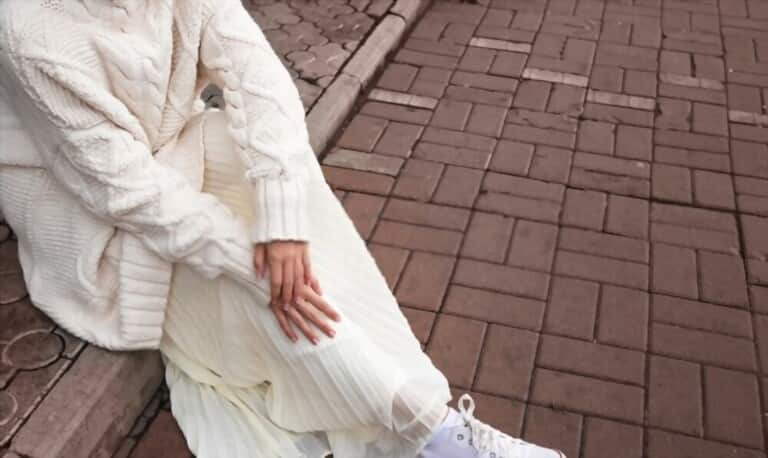 girl wearing white oversized skirt and sweater girl wearing white oversized skirt and sweater