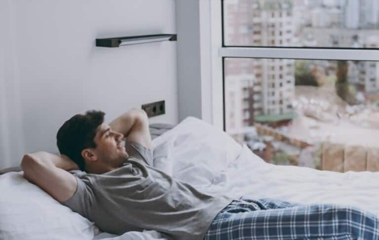 a peaceful young man wearing cotton pajamas a peaceful young man wearing cotton pajamas