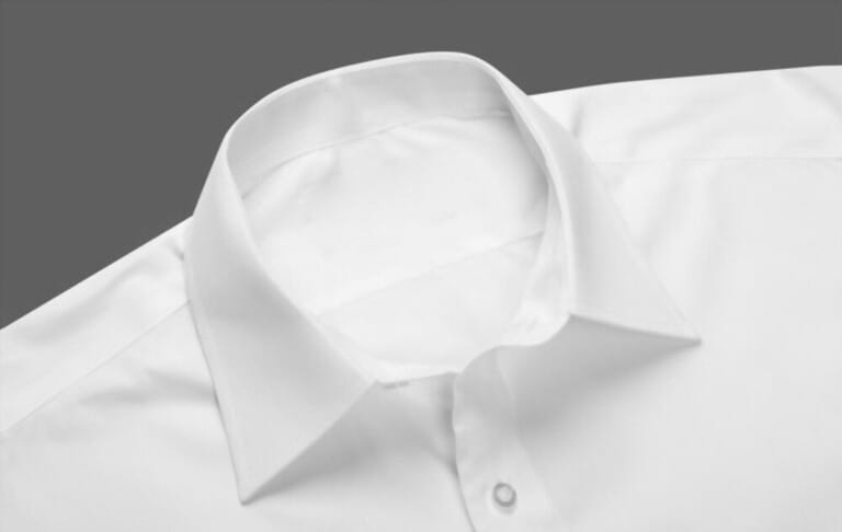 shirt with collar folded down on white background
