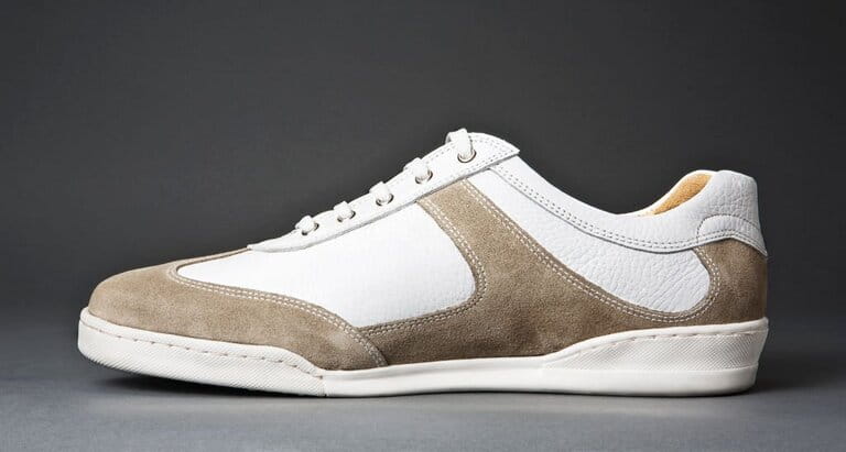 White sneakers isolated on gray background White sneakers isolated on gray background