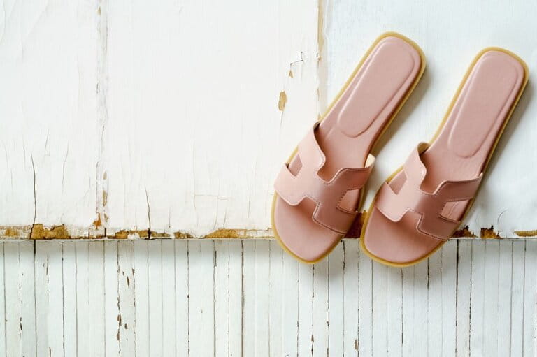 H-Sandals on grungy wood top view with copy space H-Sandals on grungy wood top view with copy space