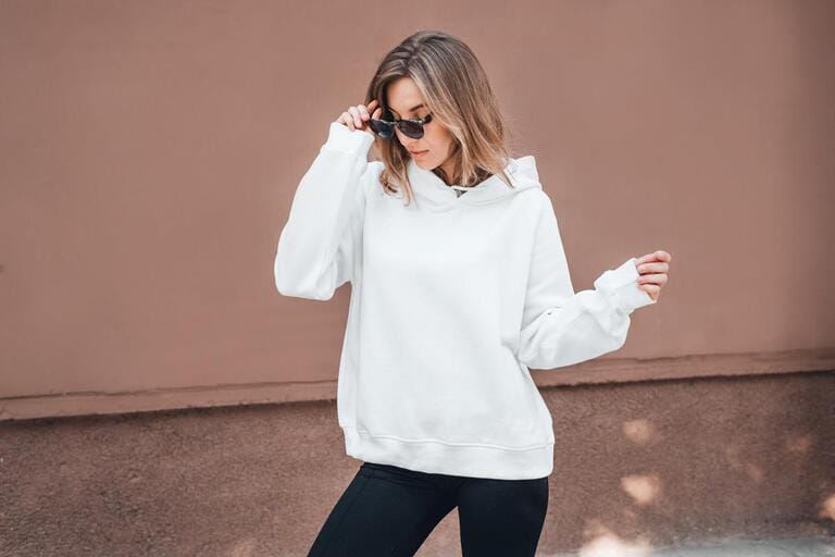 White hoodie on a young woman, mockup. Lifestyle. White hoodie on a young woman, mockup. Lifestyle.