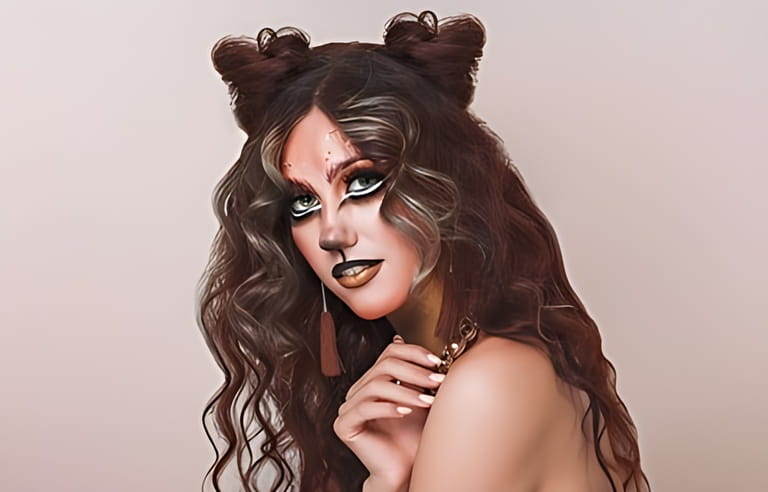 Portrait of young woman with lion make up. Halloween make-up