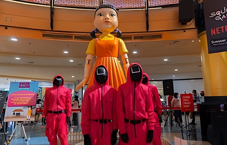 KUALA LUMPUR, MALAYSIA - 24 OCTOBER, 2021 : Guard from Squid Game at the roadshow for the promotion of new Netflix show. Squid Game is a South Korean survival drama television series KUALA LUMPUR, MALAYSIA - 24 OCTOBER, 2021 : Guard from Squid Game at the roadshow for the promotion of new Netflix show. Squid Game is a South Korean survival drama television series