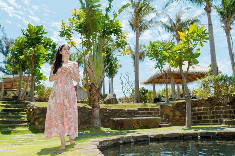 Beautiful tourist woman holding mobile phone