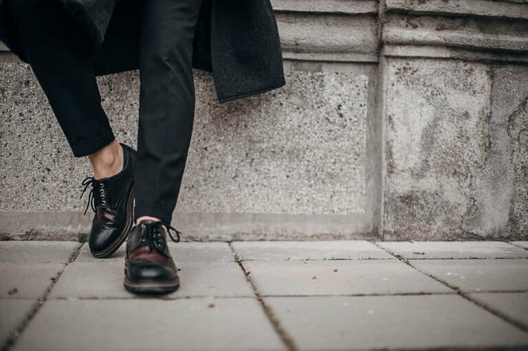 Fashionable man in leather shoes on the street Fashionable man in leather shoes on the street