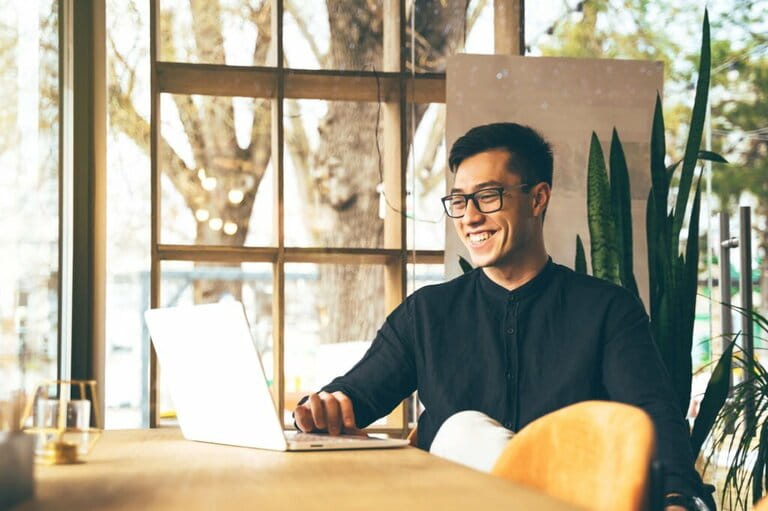 Young Asian entrepreneur is doing a video call conference at a public office Young Asian entrepreneur is doing a video call conference at a public office