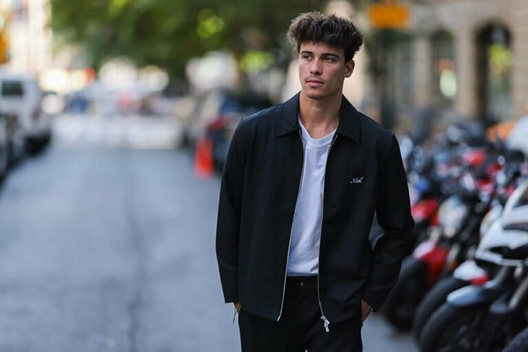 Tim Schaecker is seen wearing white t-shirt, white Prada shades, black Kith zipper jacket, black denim jeans, during New York Fashion Week Tim Schaecker is seen wearing white t-shirt, white Prada shades, black Kith zipper jacket, black denim jeans, during New York Fashion Week