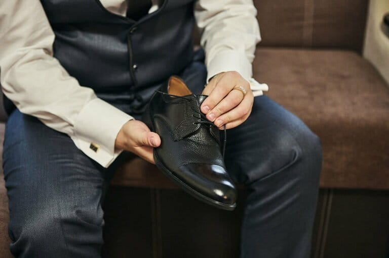 Businessman wearing clothes and shoes, man preparing for work, groom in the morning before the wedding. Men's Fashion