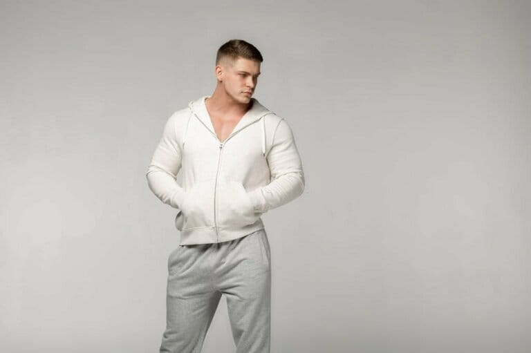 Adult instructor, personal trainer in gray sports fabric Adult instructor, personal trainer in gray sports fabric