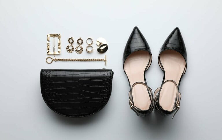 Handbag, shoes and bijouterie of stylish woman on light background, lying flat Handbag, shoes and bijouterie of stylish woman on light background, lying flat