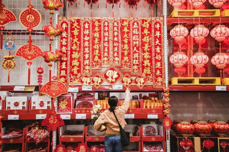 Asian woman shopping for Chinese New Year decoration Asian woman shopping for Chinese New Year decoration