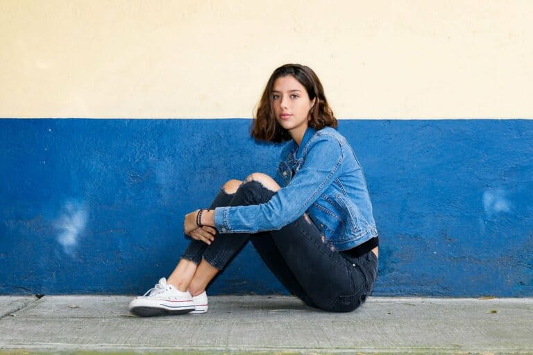 One hispanic teenage girl sitting on the floor in Mexico City, Mexico One hispanic teenage girl sitting on the floor in Mexico City, Mexico