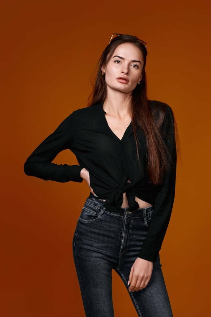Full body woman in black shirt and jeans