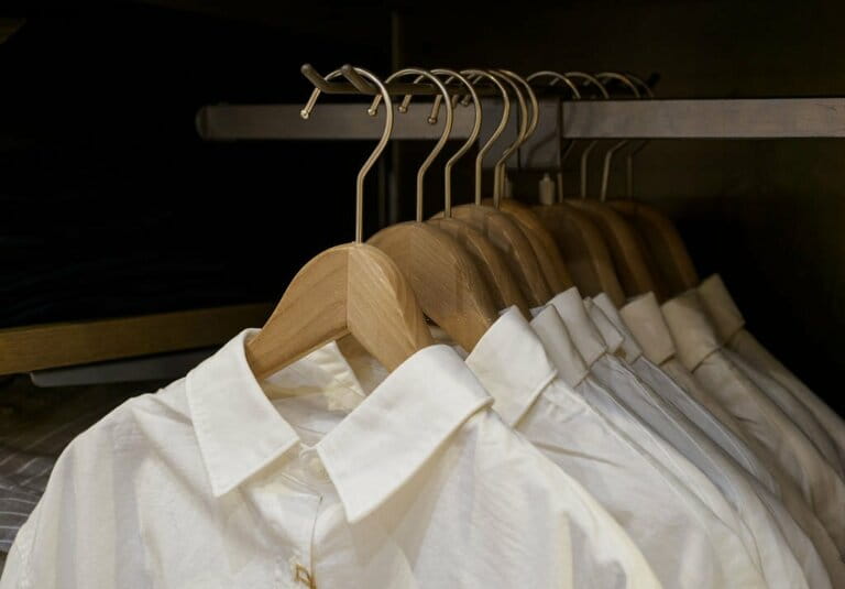 Close-up of men's white shirts in a clothing store