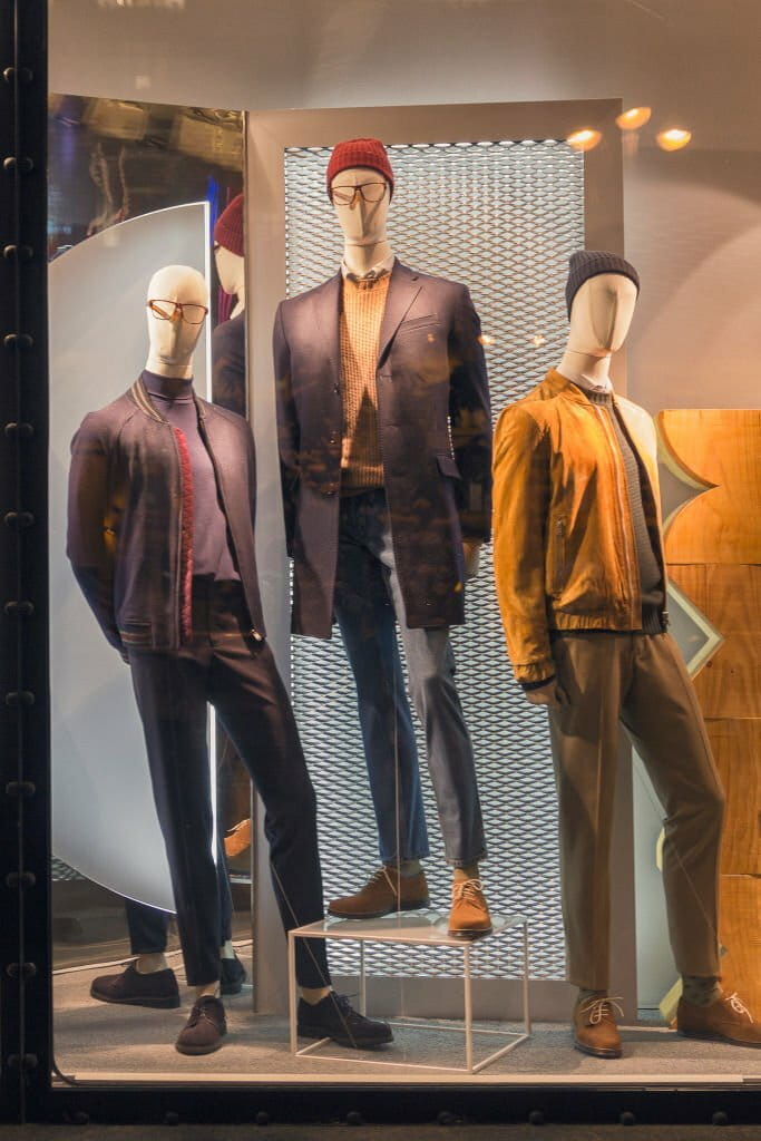 Mannequins in shop windows and city reflections Mannequins in shop windows and city reflections