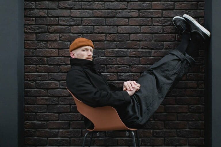 Young stylish man in the black trendy outfit Young stylish man in the black trendy outfit