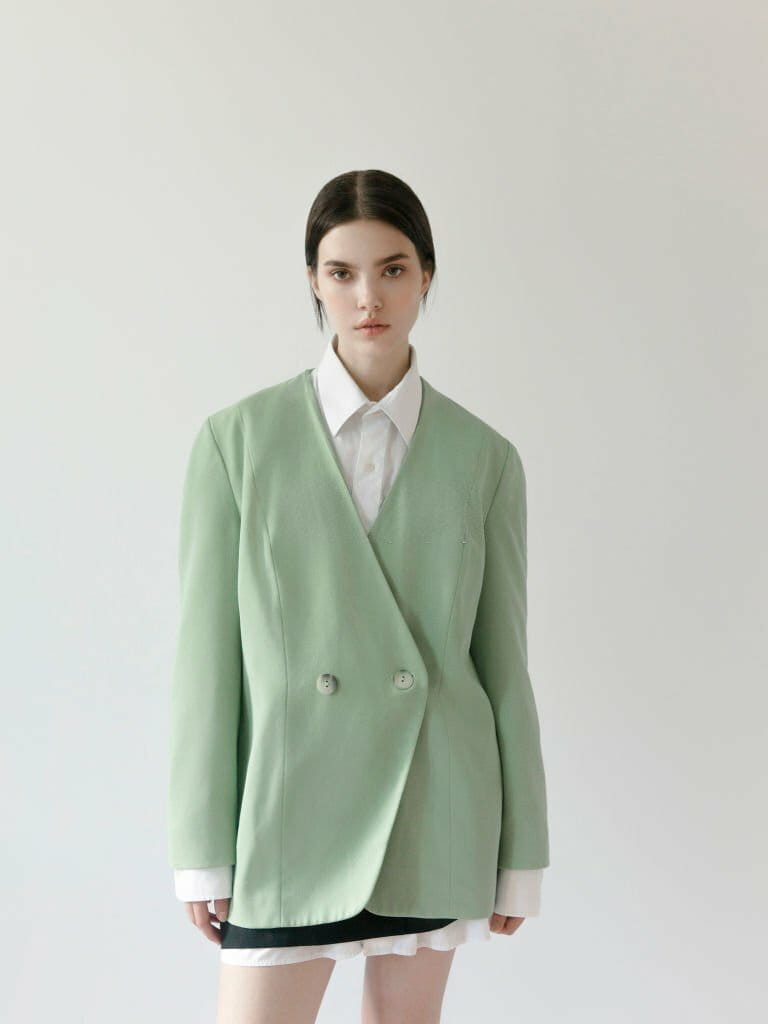 Cute young girl looks beautiful wearing light mint green blazer White black tshirt mini skirt Korean and classic fashion style Cute young girl looks beautiful wearing light mint green blazer White black tshirt mini skirt Korean and classic fashion style