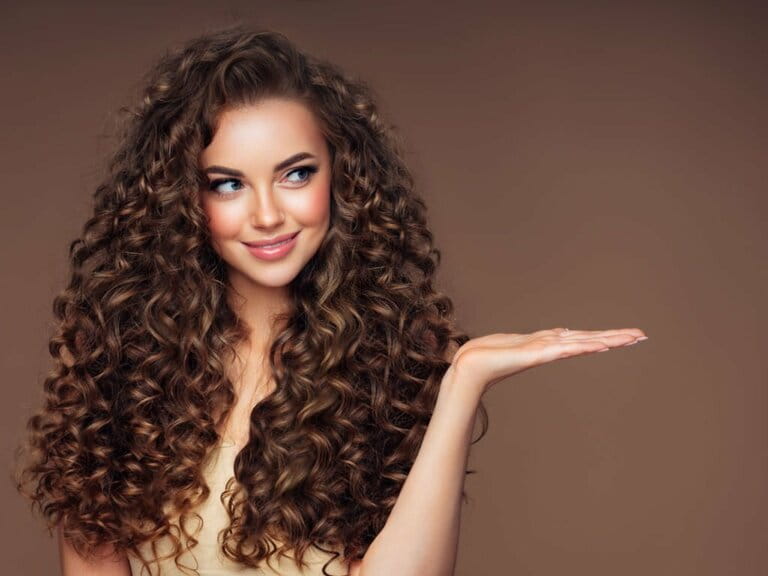 Beautiful woman with voluminous curly hairstyle Beautiful woman with voluminous curly hairstyle