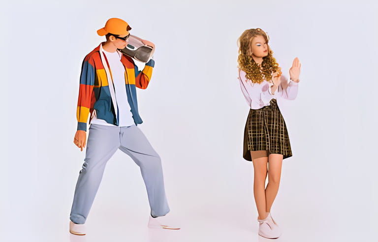 Portrait of stylish young man in trendy colorful jacket with music player posing with beautiful girl isolated on grey background. Dating. Portrait of stylish young man in trendy colorful jacket with music player posing with beautiful girl isolated on grey background. Dating.