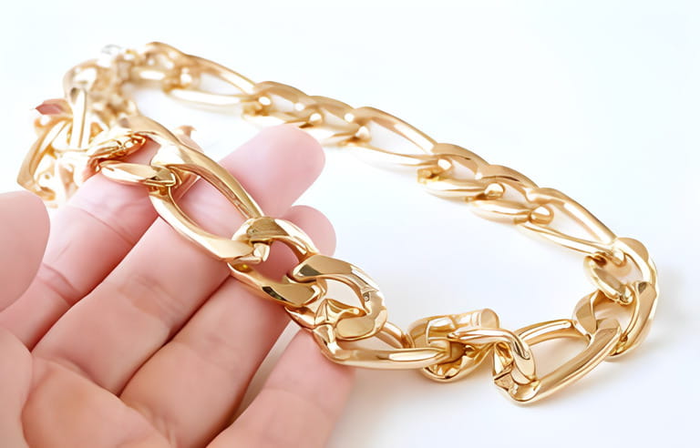 jeweler takes in hands the big gold chain on white background, jewerly inspect and verify