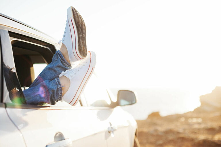 Tourist woman resting in car
