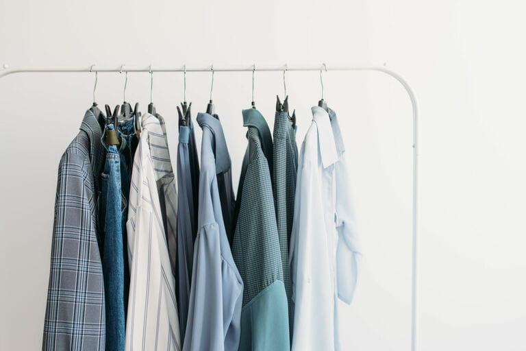 The rack with capsule clothes is blue