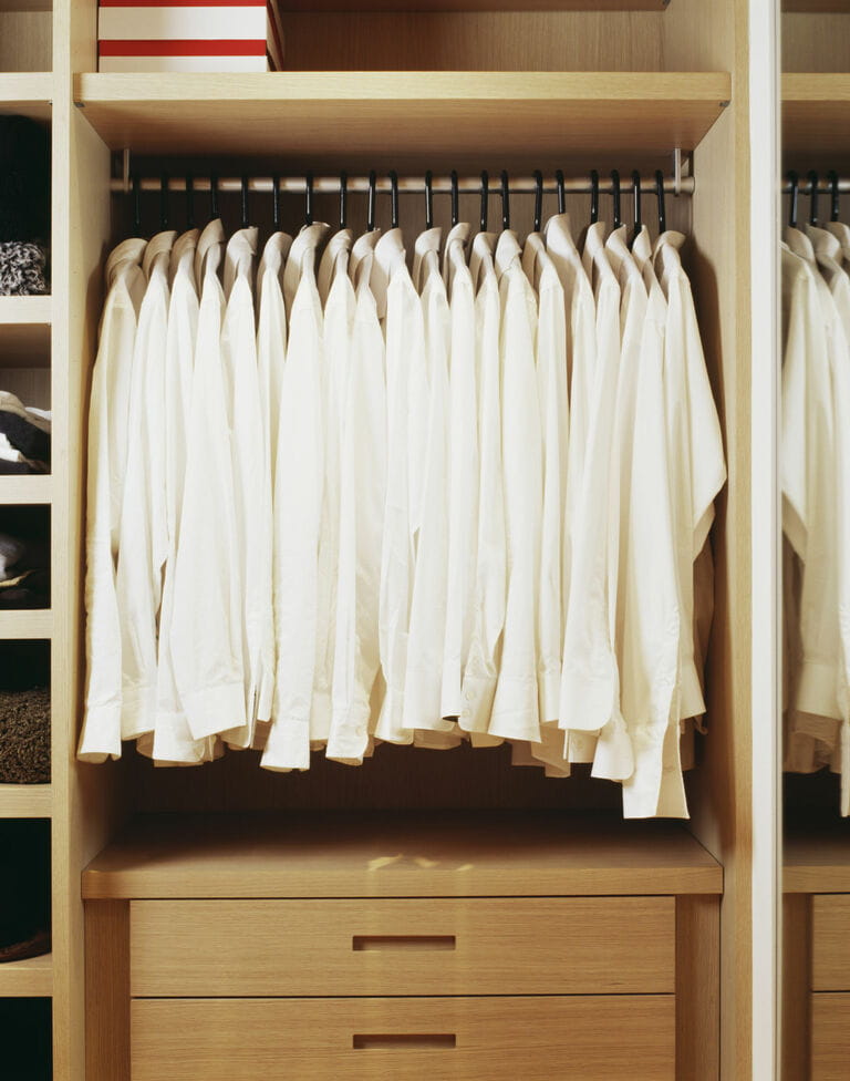 White shirts hanging in closet