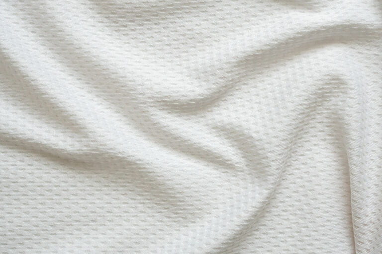 White sportswear fabric football shirt texture background White sportswear fabric football shirt texture background