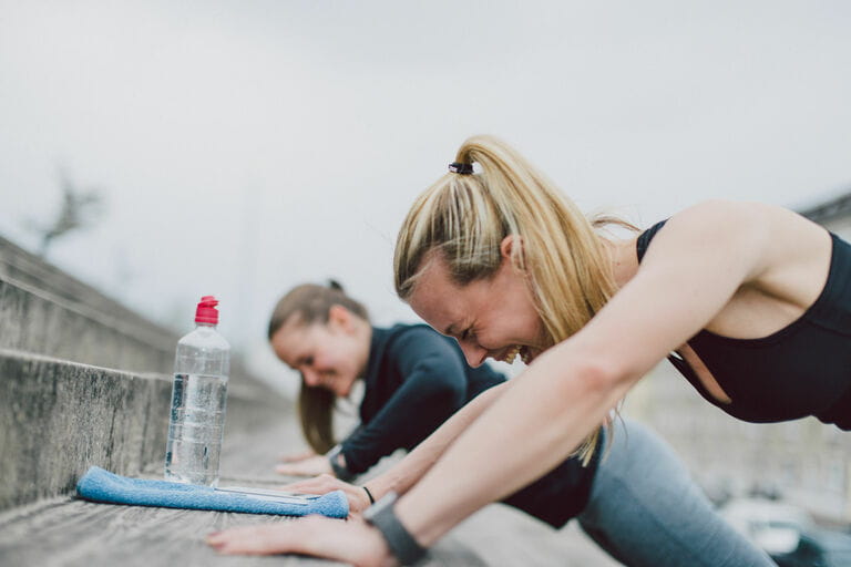 Girlfriends doing push-ups together Girlfriends doing push-ups together