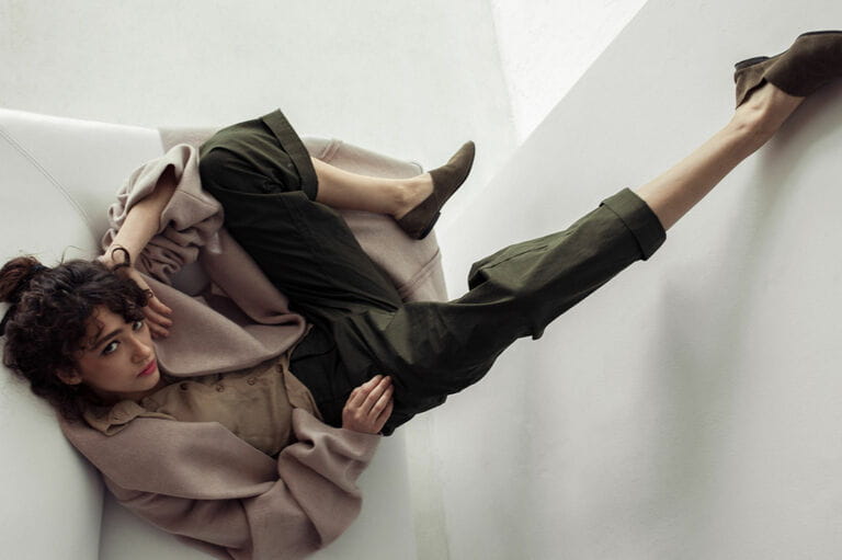 Fashionable woman raising leg Fashionable woman raising leg