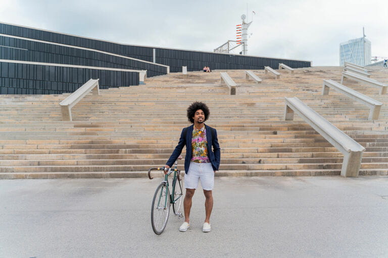 Stylish man with bicycle standing at stairs Stylish man with bicycle standing at stairs