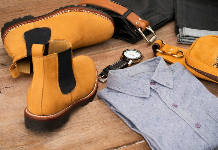 Set of men's fashion casual clothes and accessories on wooden background Set of men's fashion casual clothes and accessories on wooden background