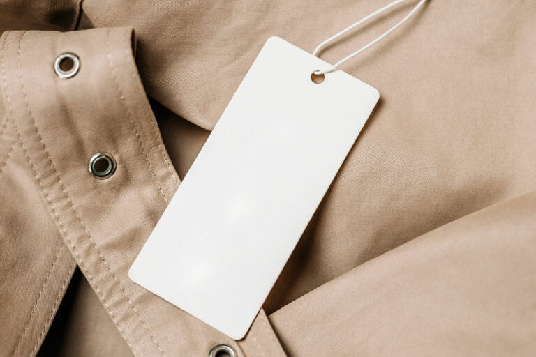 Khan and Tag on beige raincoat fabric. mockup for close-up design