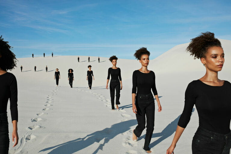 Multiple image of young female models walking at desert