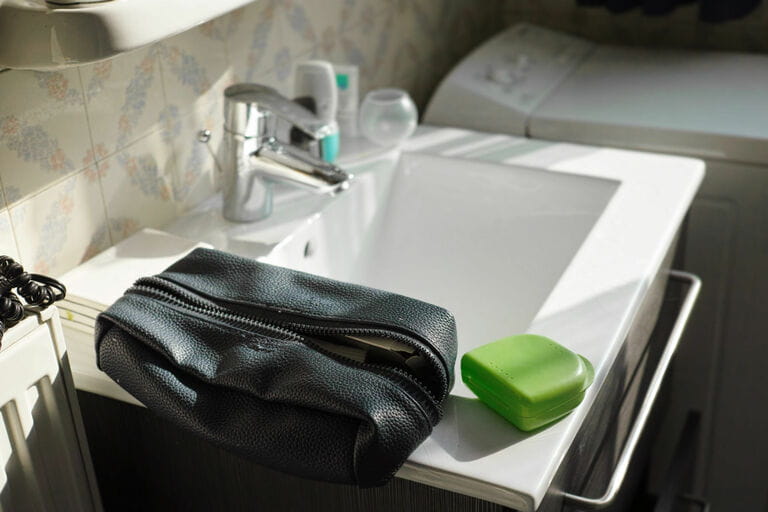 Toiletries bag on the bathroom sink Toiletries bag on the bathroom sink