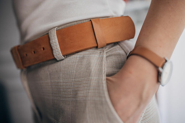 Woman wearing modern leather belt